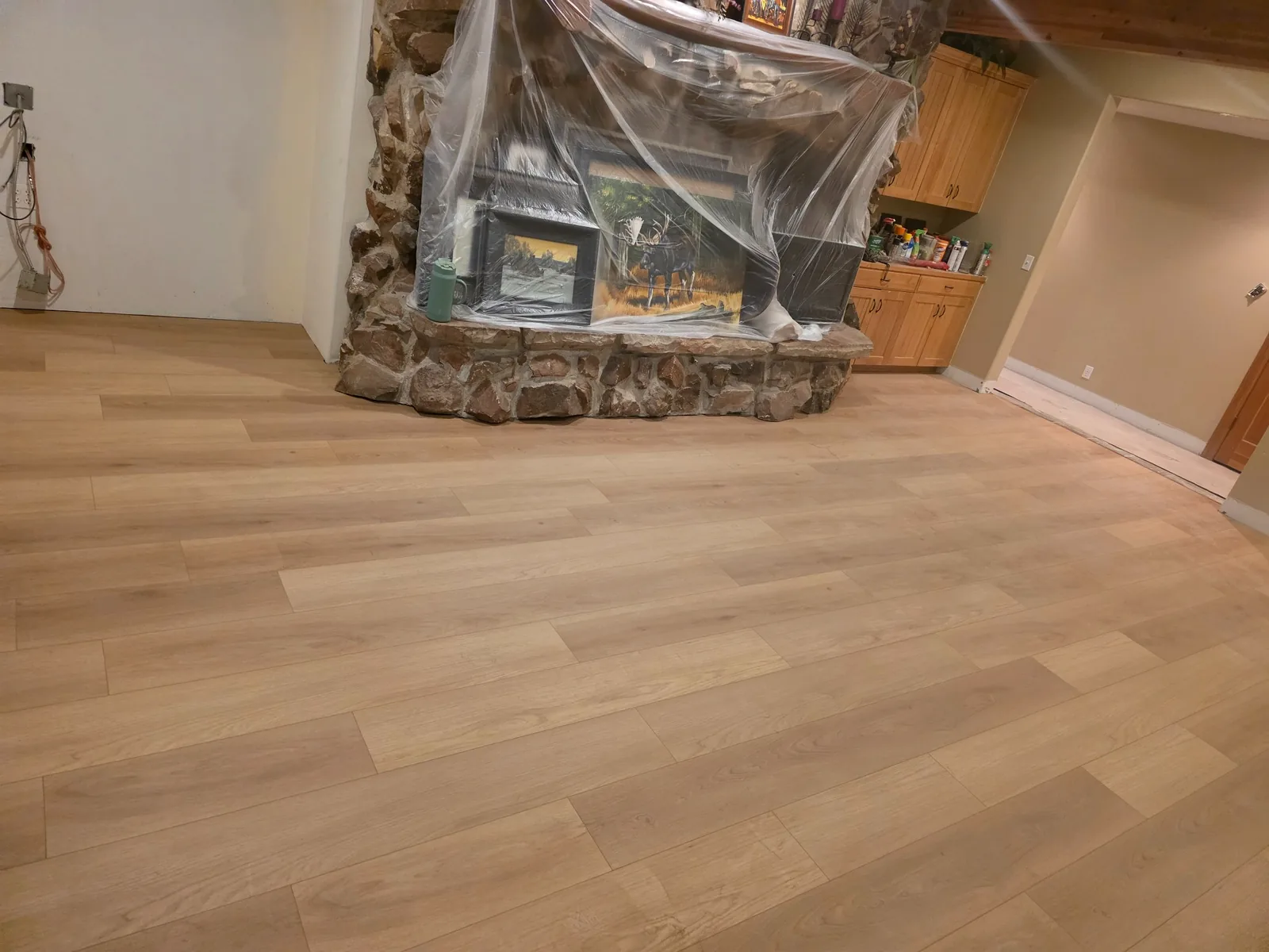 Light wood-look flooring installation by T&S Floors in Utah County
