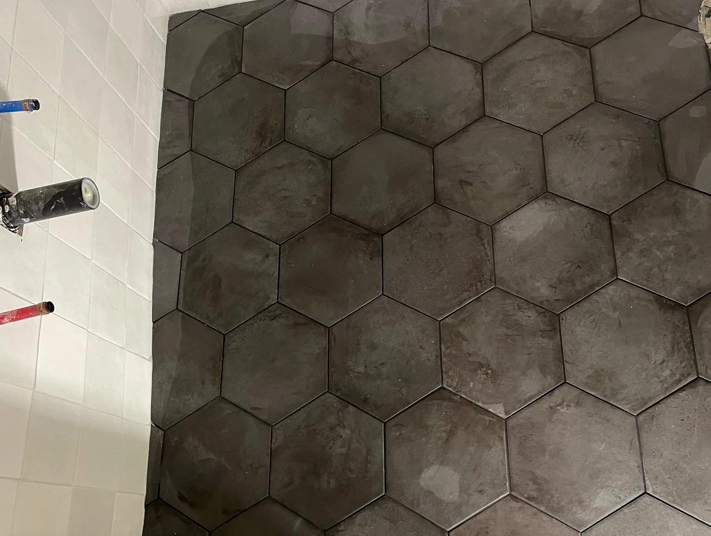 Dark hexagon shower tile by T&S Floors in Utah County