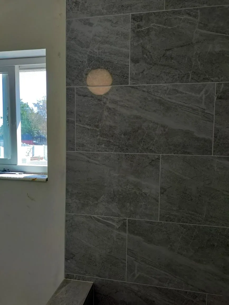 Gray large-format shower tile by T&S Floors in Utah County