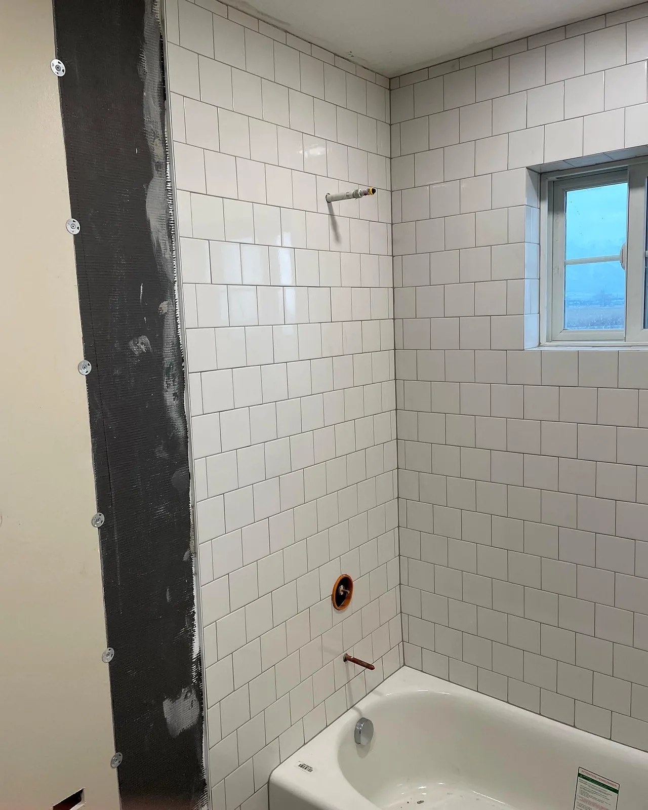 White subway tile shower by T&S Floors in Utah County